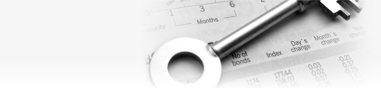 Banner picture of a key atop a balance sheet